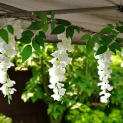 Solar Powered 180cm Artificial Leaf Garland With Wisteria Flowers - Warm White -B&M 379258 180cm solar powered artificial leaf garland with wisteria flowers 20 warm white micro leds